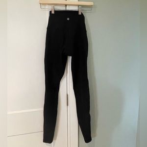 Black Lulu Leggings with mesh striped detail. Size 4.